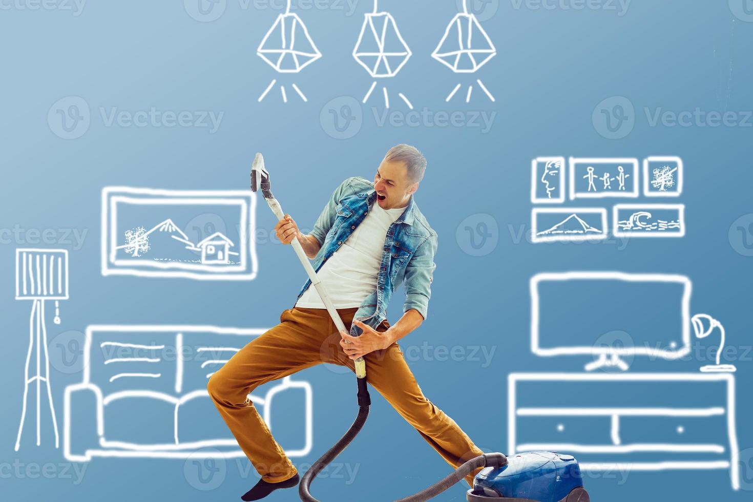 man vacuuming over drawn home plan photo