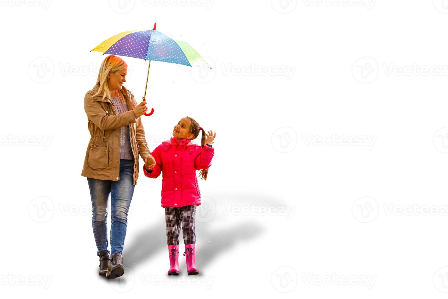 Happy young family using umbrella. Isolated on white mother daughter photo