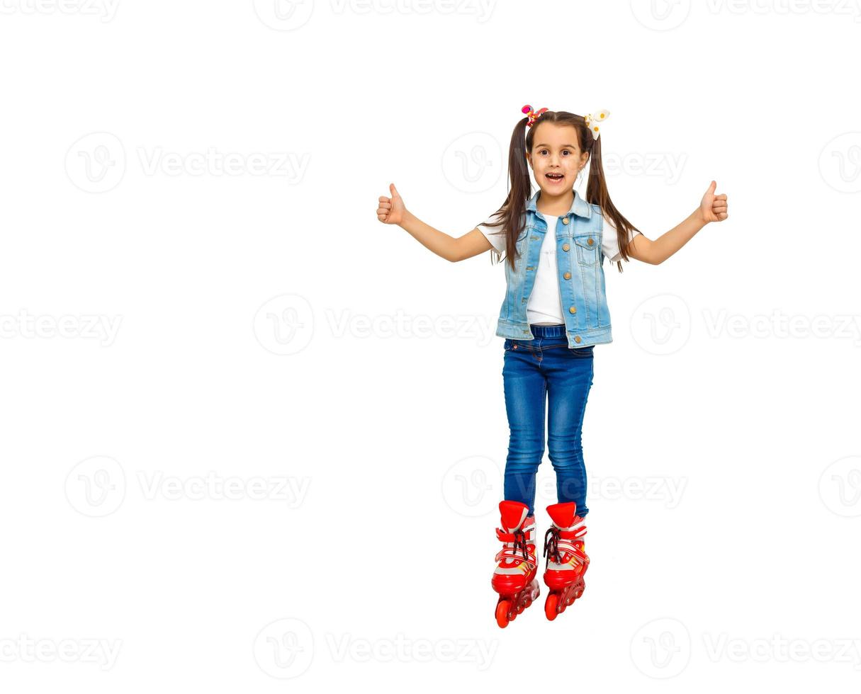 Cute girl in roller skates on a white background photo