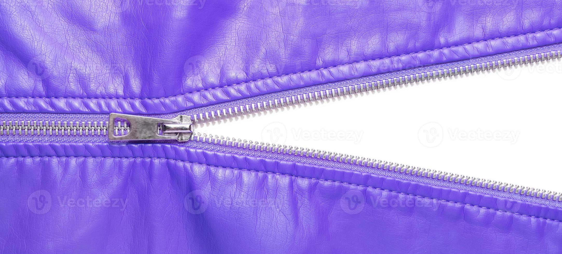 Purple leather texture and open metal zipper isolated on white background photo