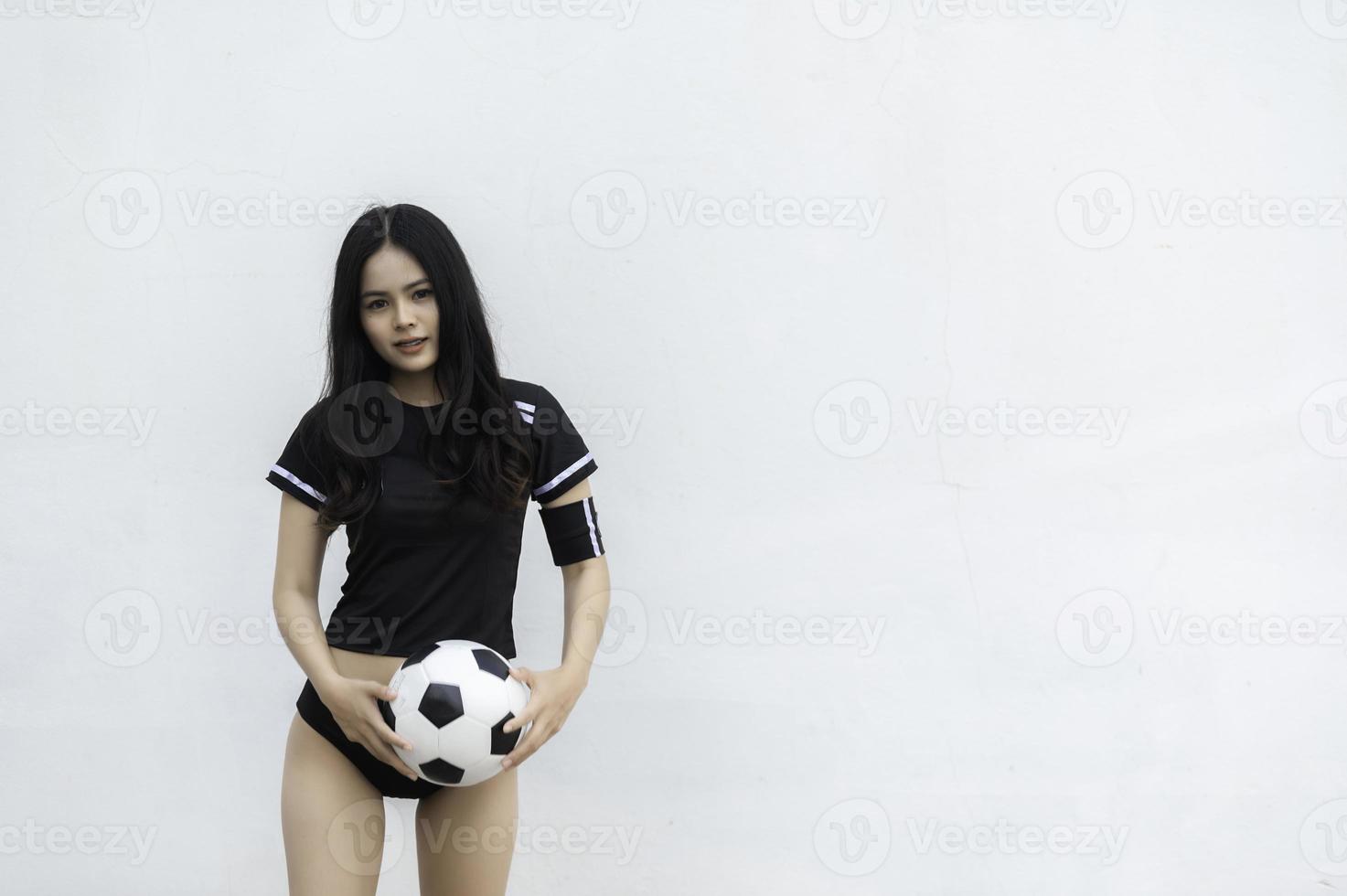 Young beautiful asian woman wear soccer player cheer sport,Female fans football cheering game photo