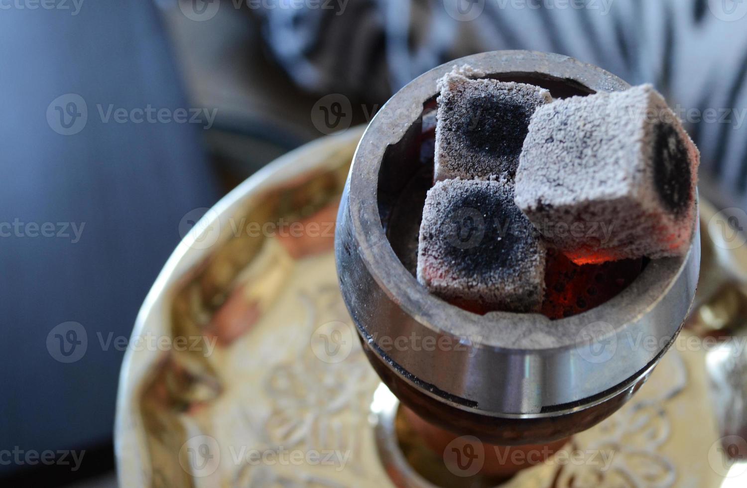 hookah smoking, hot coals for hookah in callaud, coconut charcoal, hookah accessories, top view photo