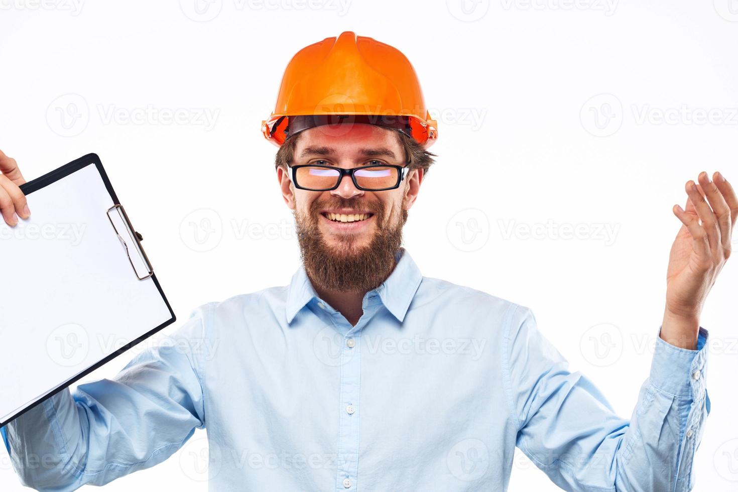 Emotional man in orange paint documents construction Manual drawings engineer photo