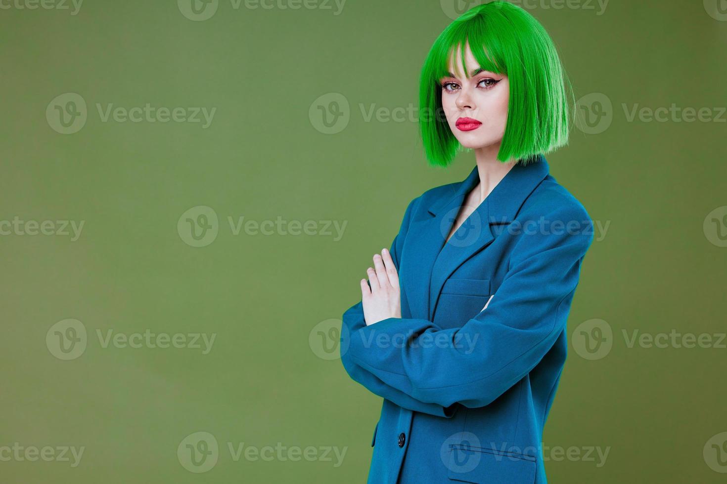 Portrait of a charming lady fun gesture hands green hair fashion color background unaltered photo