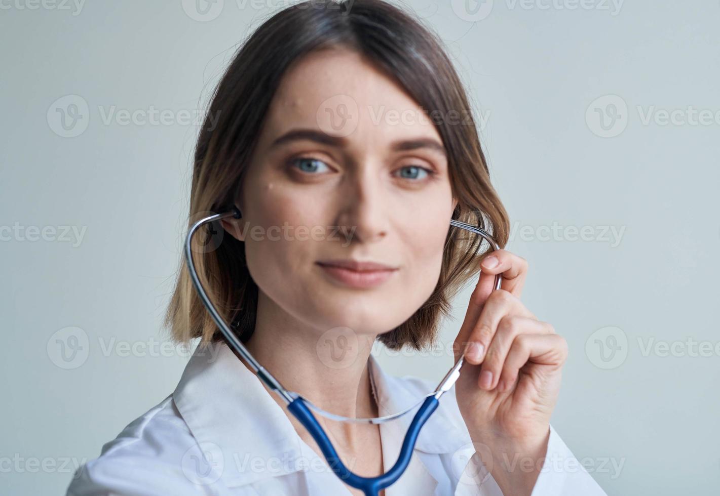Blue stethoscope woman doctor professional worker portrait cropped view photo