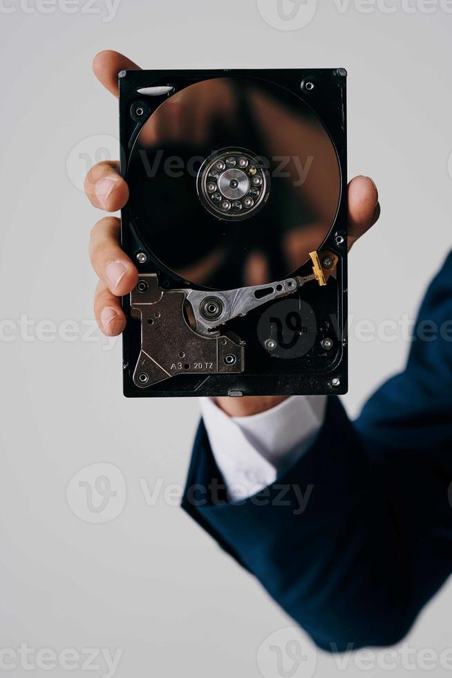 computer hard drive in hands technology close-up photo