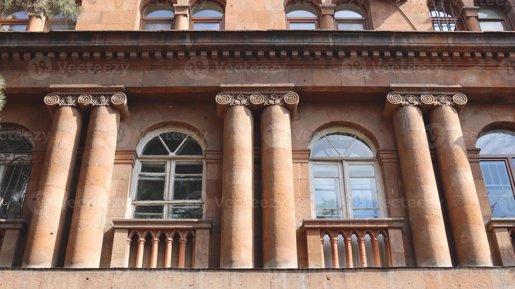 Close up front view of the old building in Yerevan concept photo. Urban architectural photography. photo