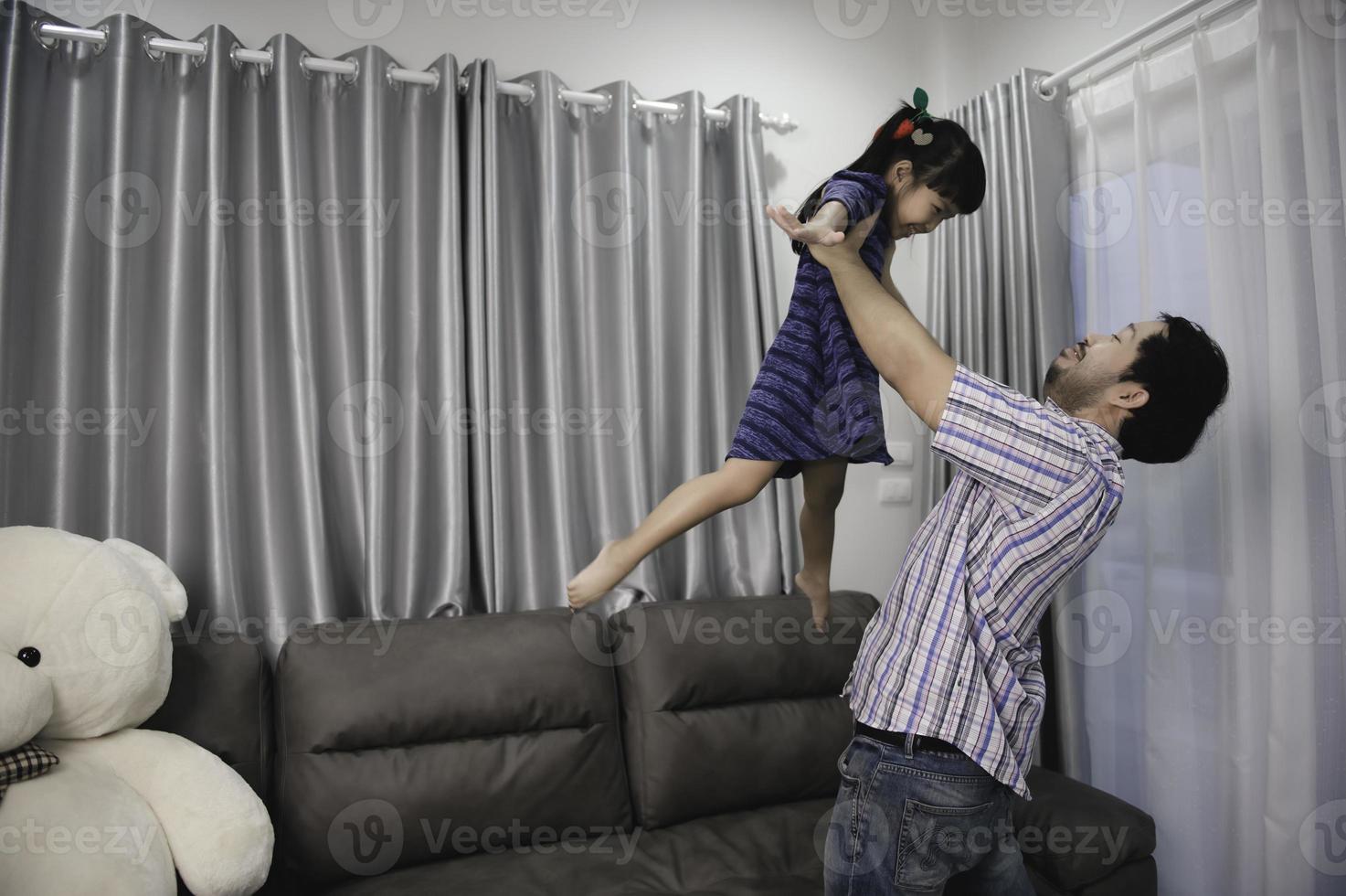 Father day concept,Asian young handsome Father and daughter stay at home together photo