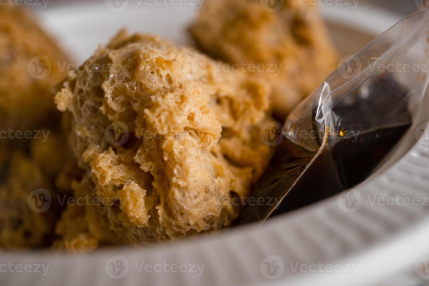 Close up photo of Tahu Walik Javanese traditional food with golden color. The photo is suitable to use for traditional food background, poster and food content media.