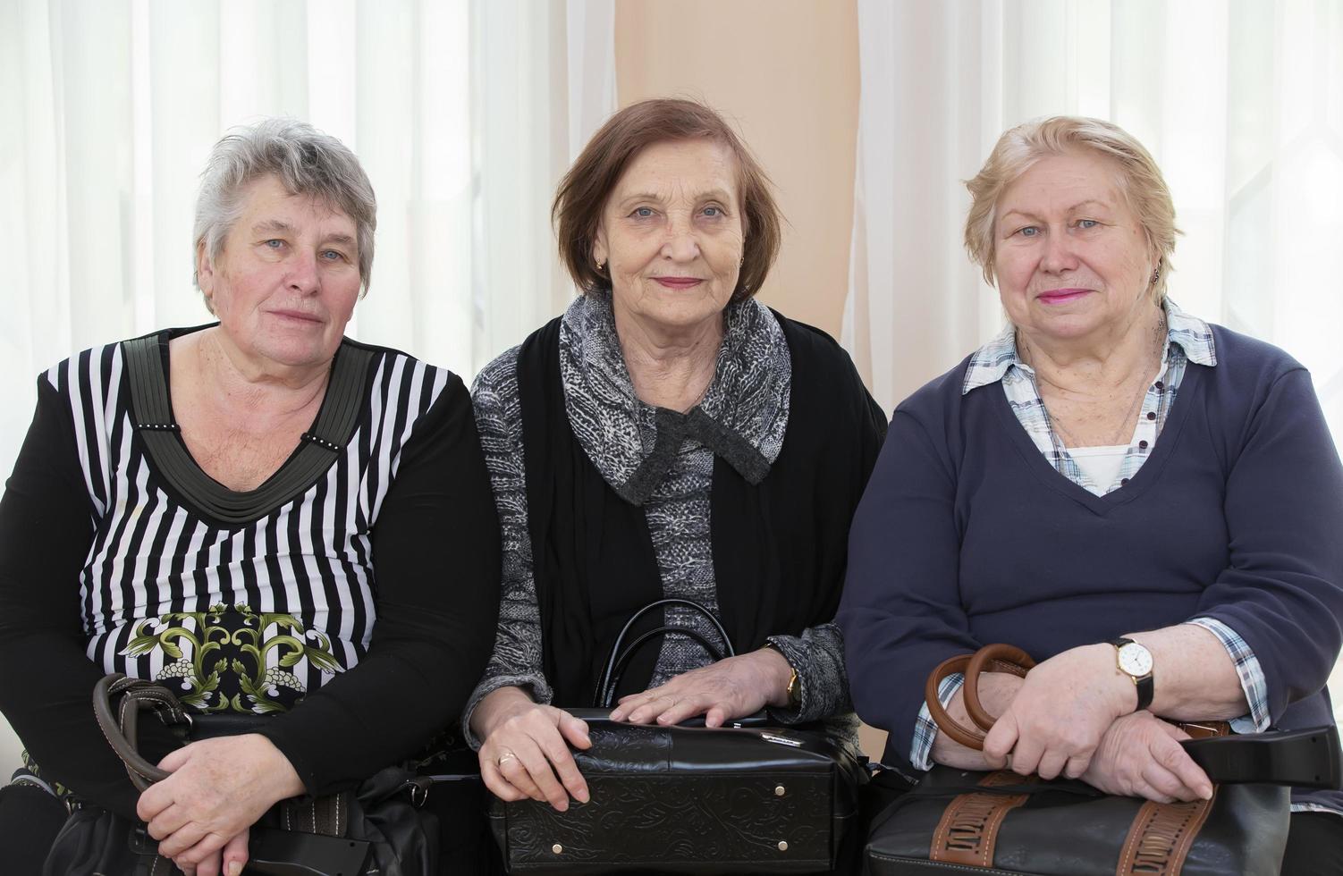Three older women. Old girlfriends. Retired. Seventy year old women. photo
