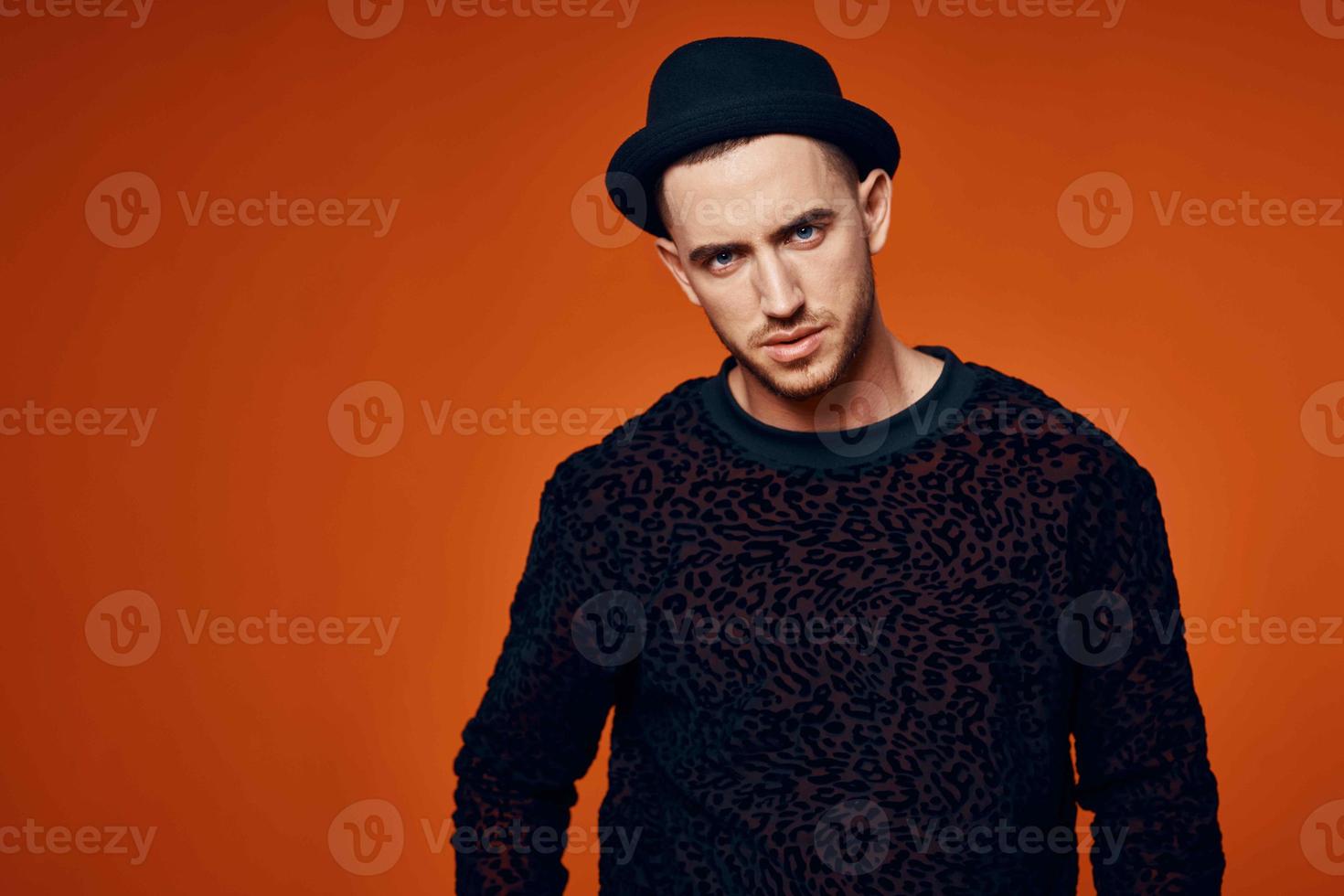 man in black sweater with hat fashion studio modern style photo