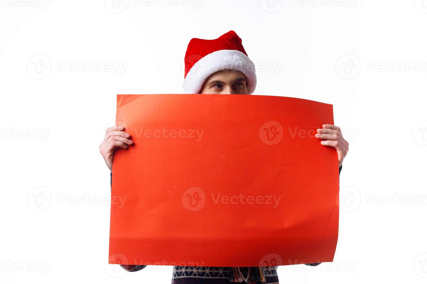 Cheerful man in a christmas hat with Red mockup poster copy-space studio photo