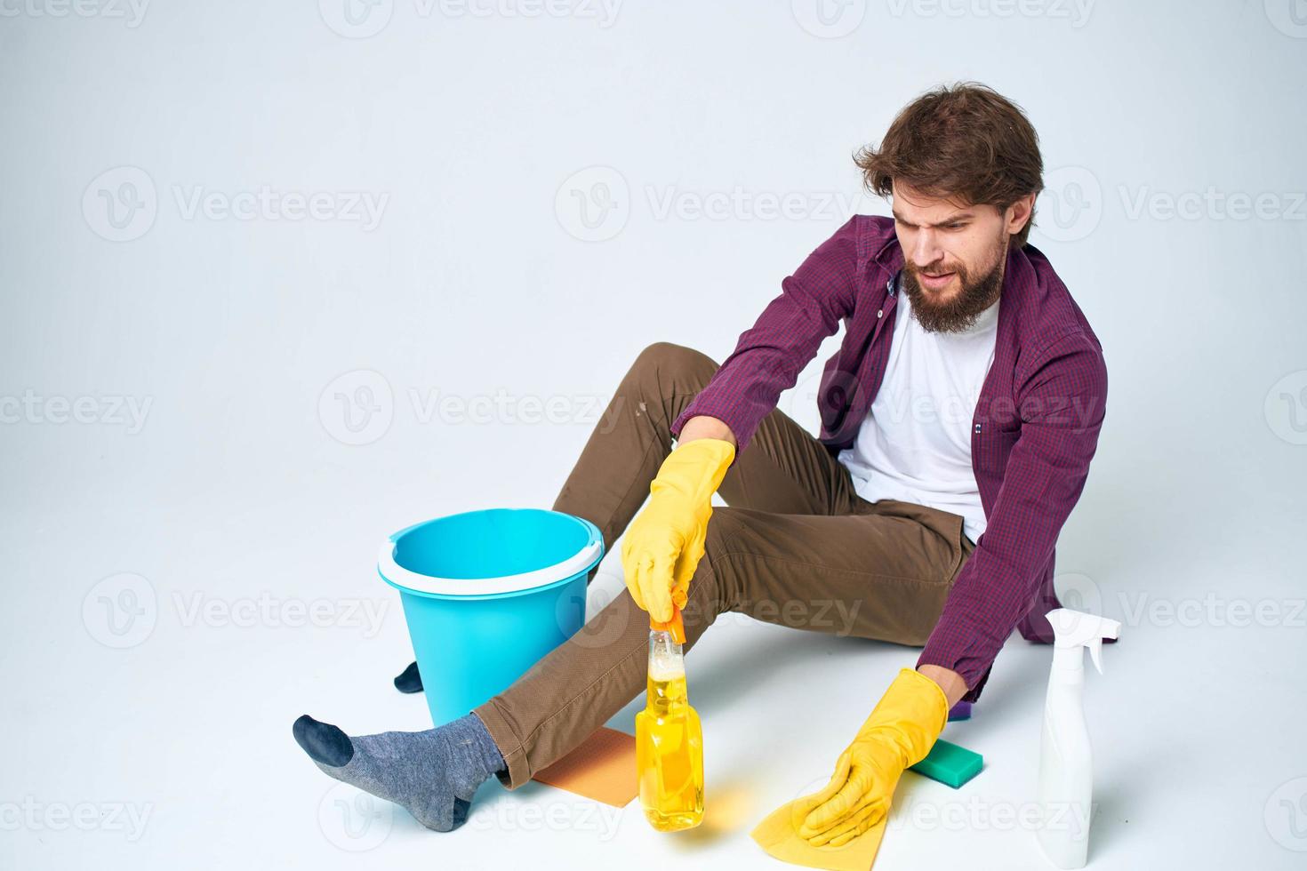 cleaner lying on the floor with a bucket of detergent cleaning service rendering Professional photo