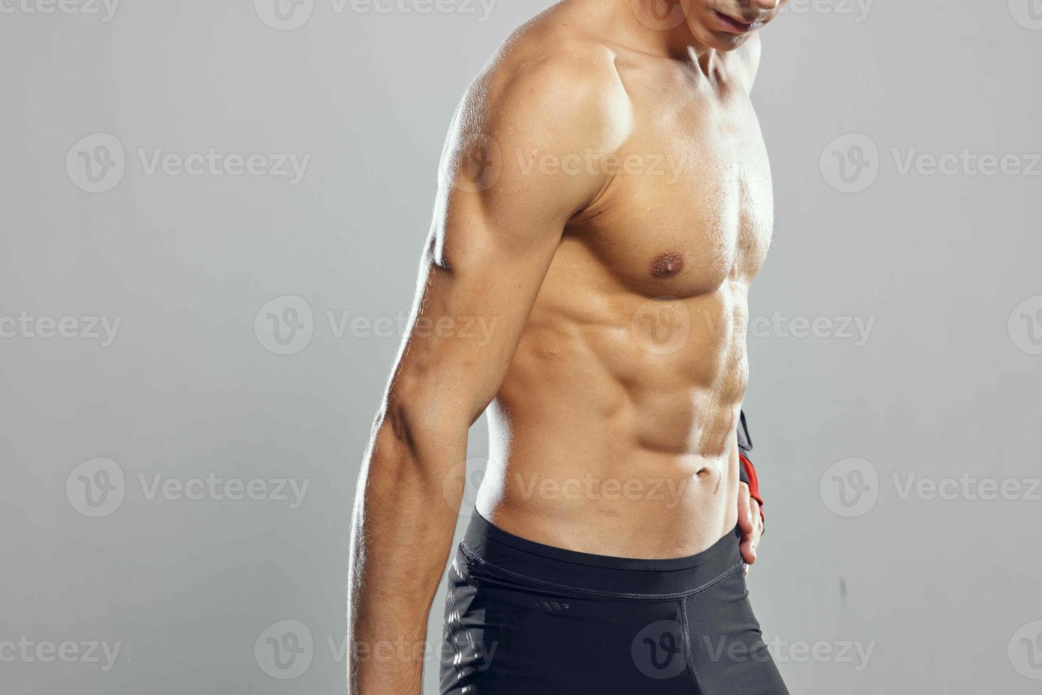 sporty man inflated stroller white briefs home workout gym photo