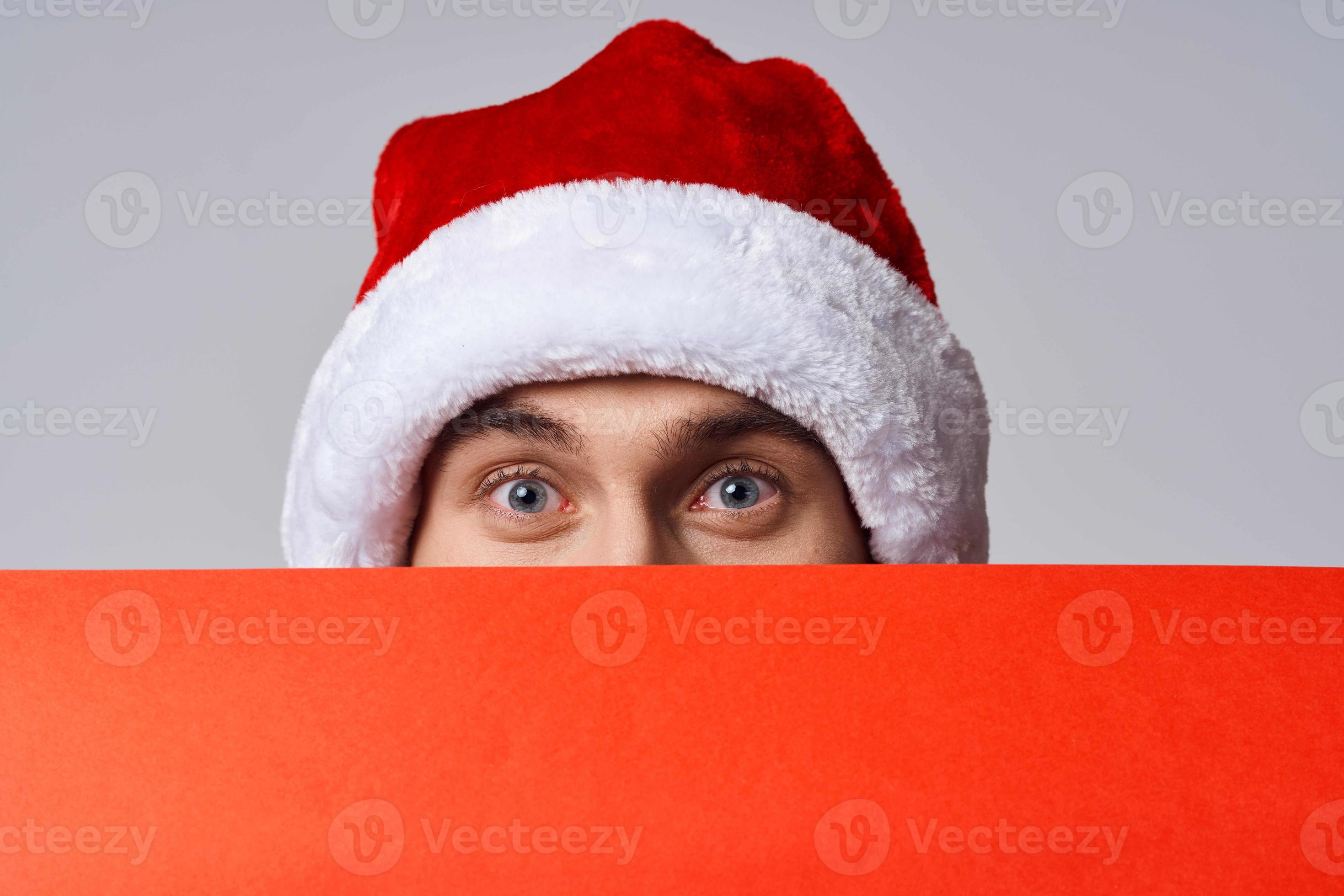 Cheerful man in New Year's clothes holding a banner holiday isolated  background 22248391 Stock Photo at Vecteezy