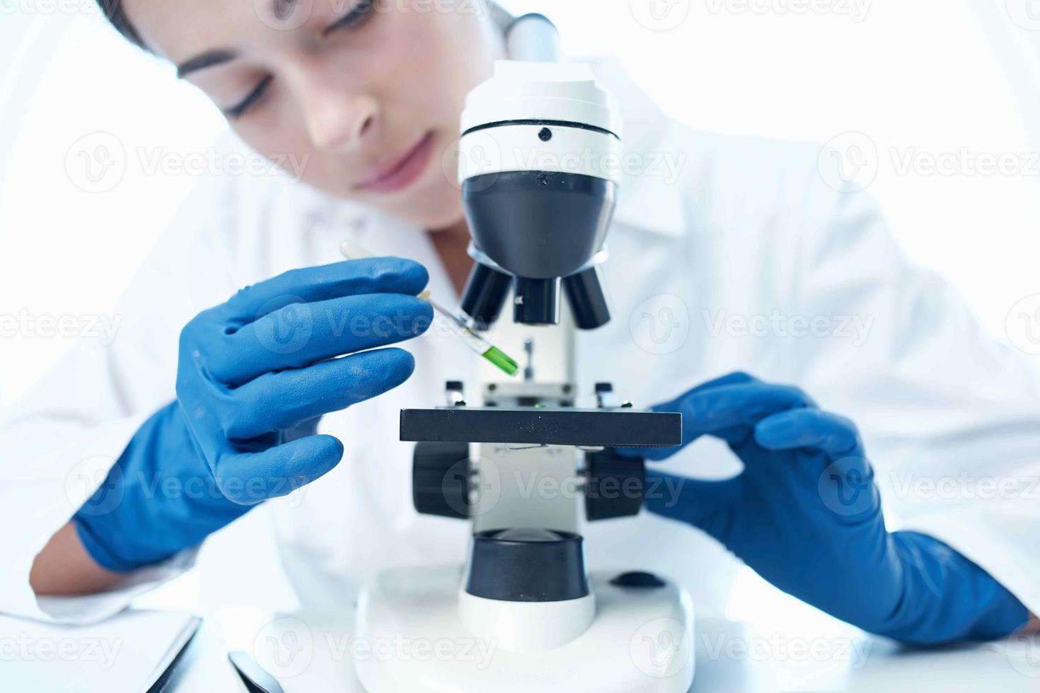 woman laboratory assistant microscope research biotechnology science photo