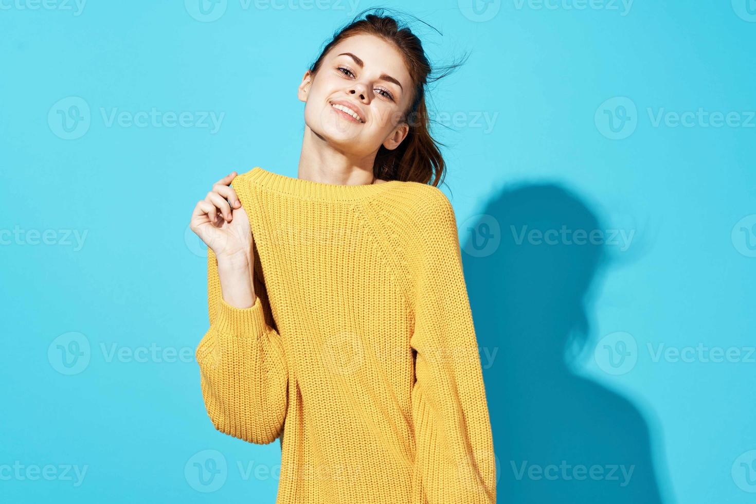 woman in yellow sweater fashion posing glamor close-up photo