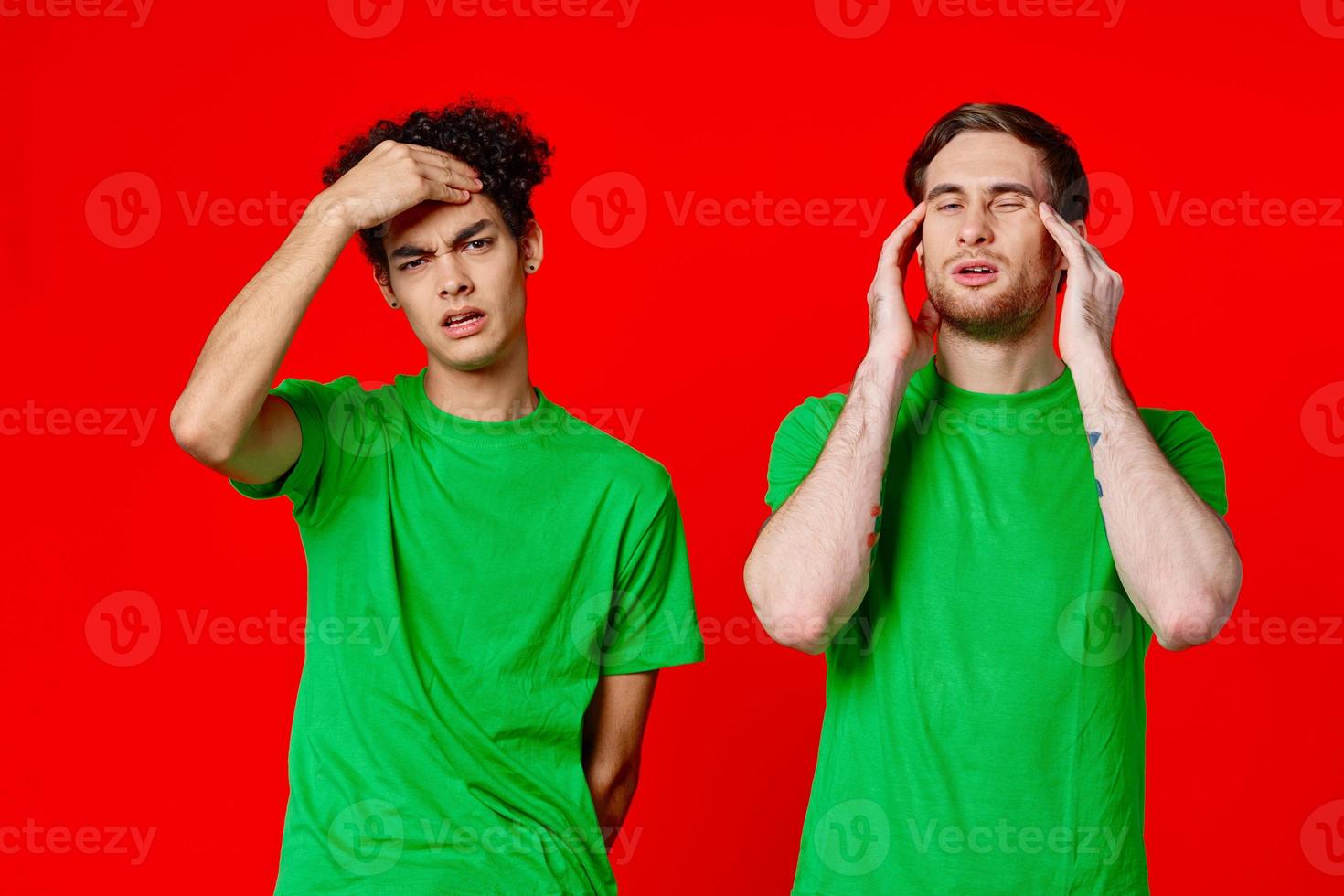 two man holding his neck emotions discontent red background photo