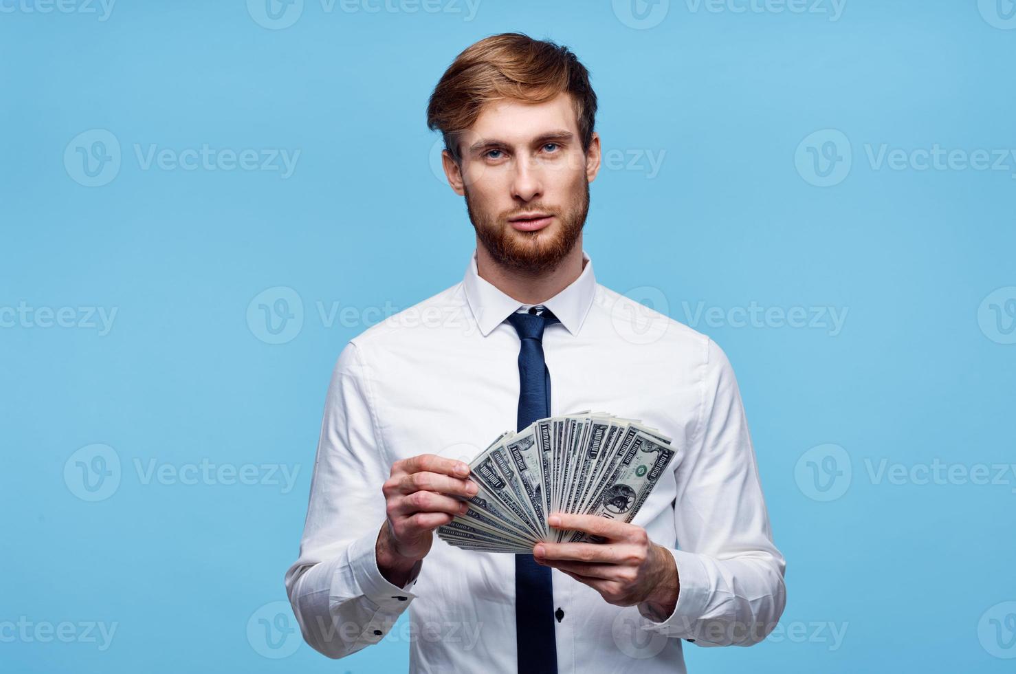 business man in shirt with tie bundle of money in the hands of the office photo