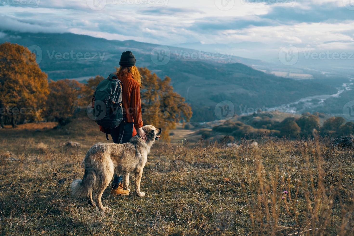 cheerful woman tourist next to dog and walk friendship journey photo