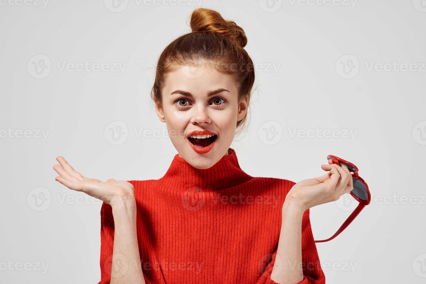 beautiful woman in a red sweater isolated background photo