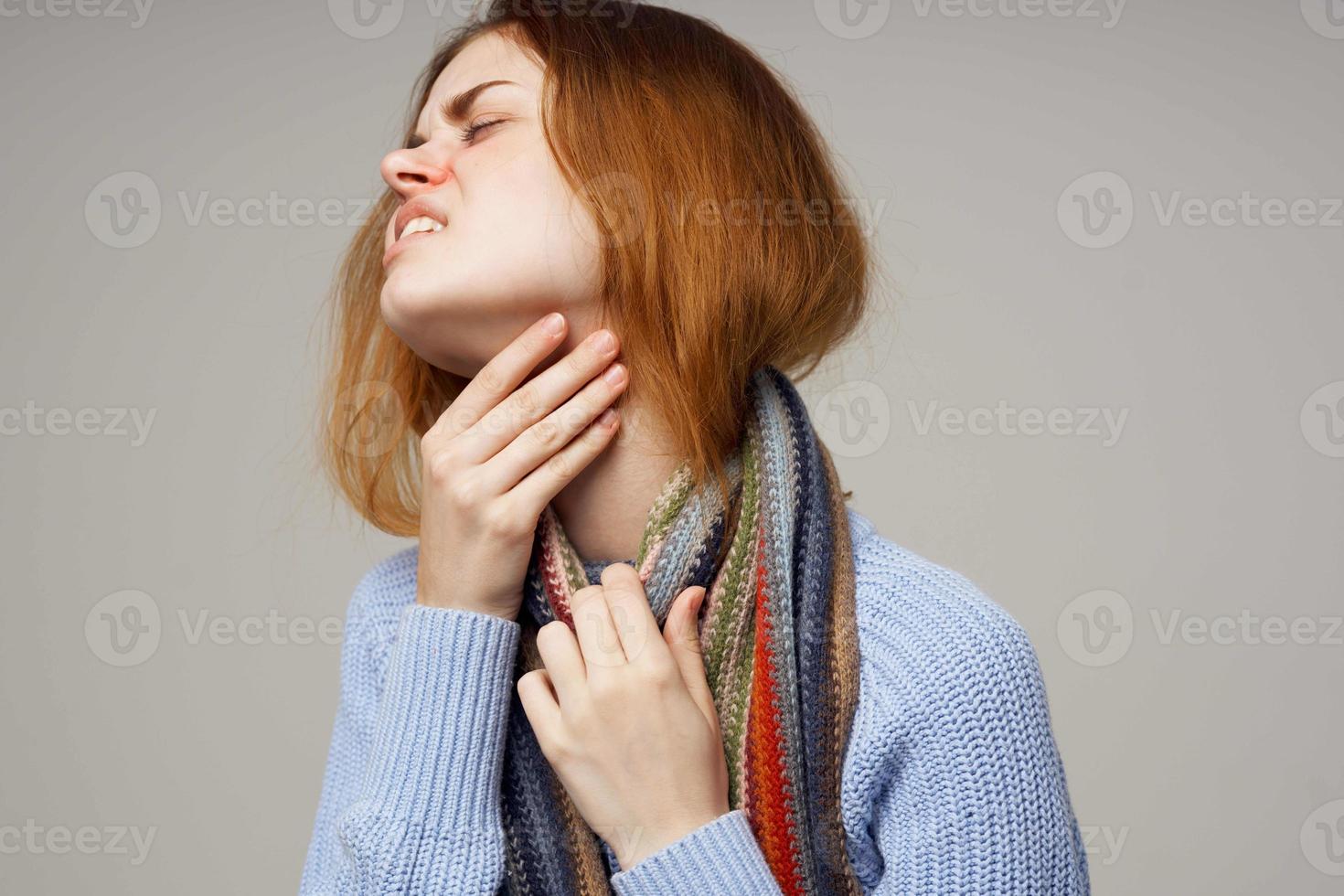 red-haired woman health problems temperature light background photo