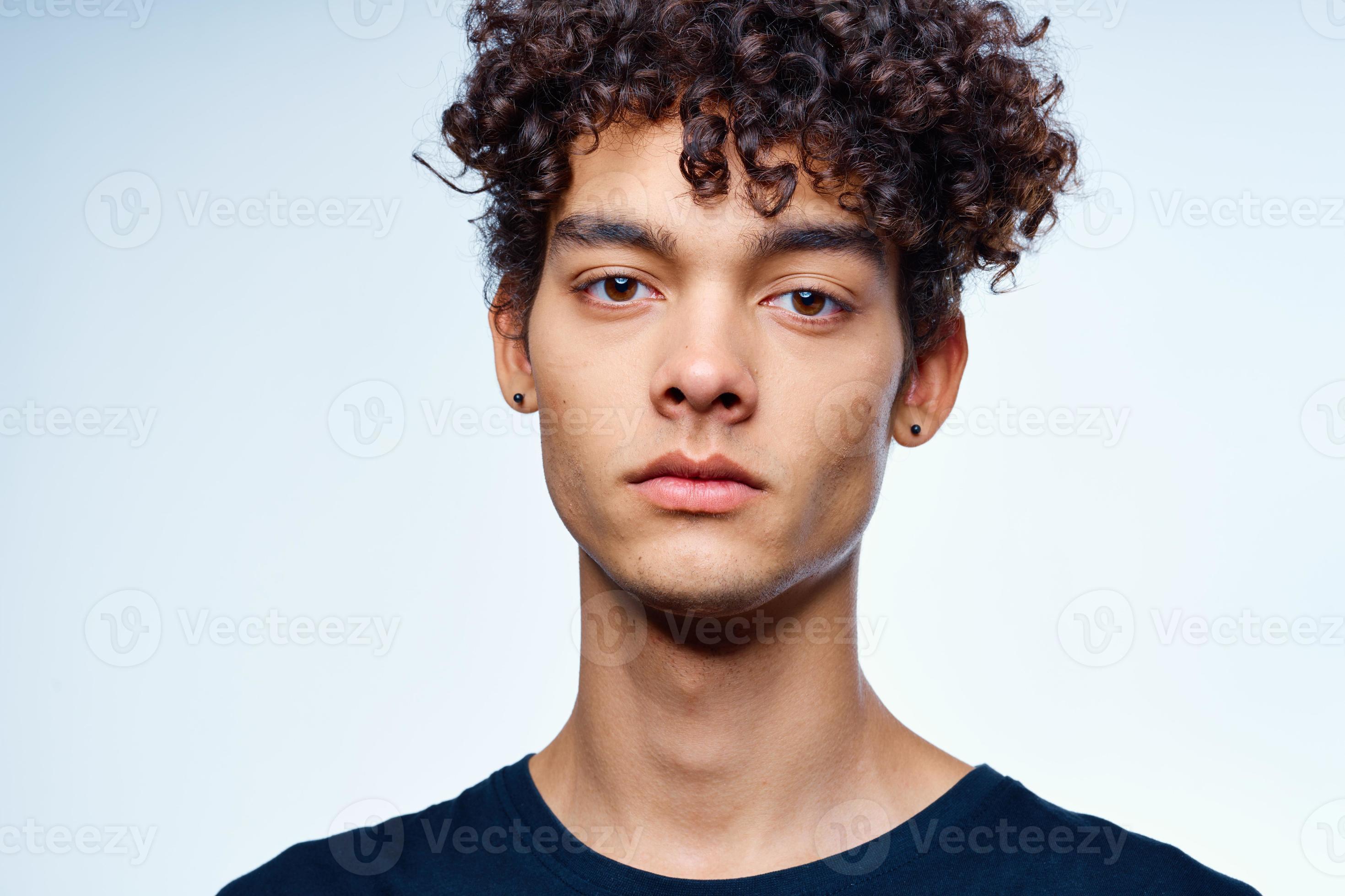 cute guy with curly hair cropped view isolated background studio