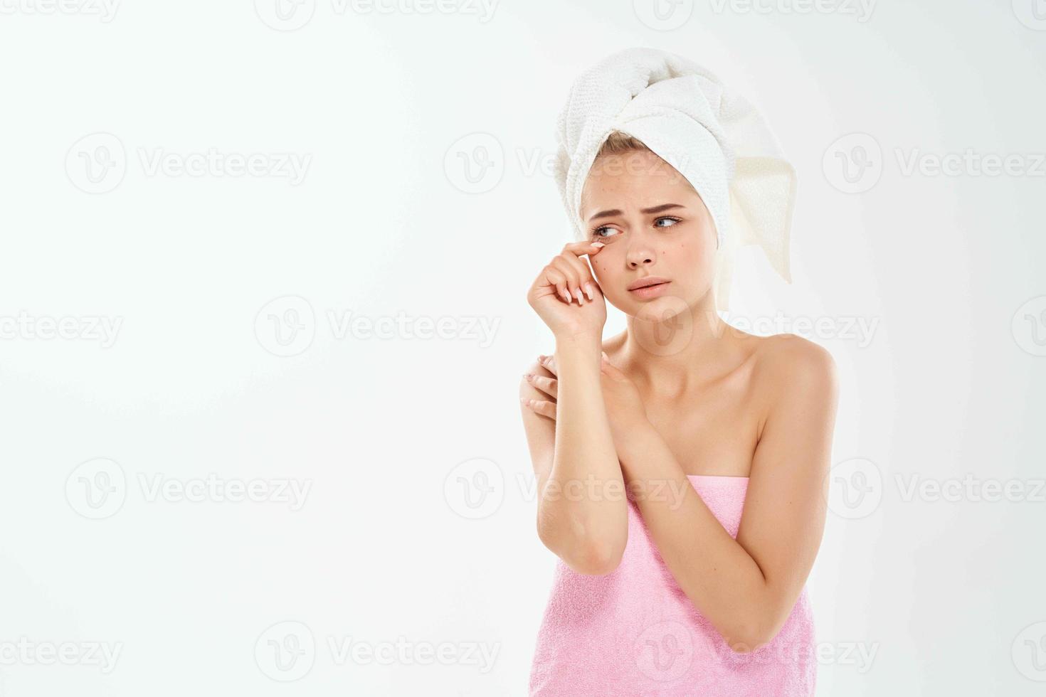woman with towel bare shoulders skin care dermatology problems photo