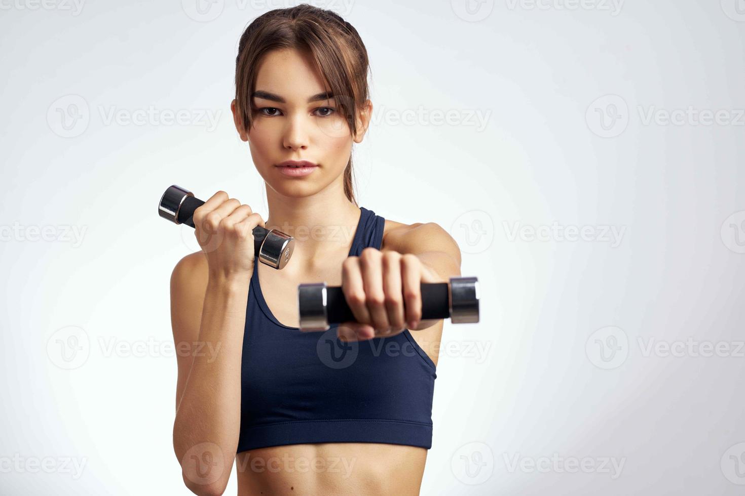 sportive woman workout with dumbbells fitness motivation lifestyle photo