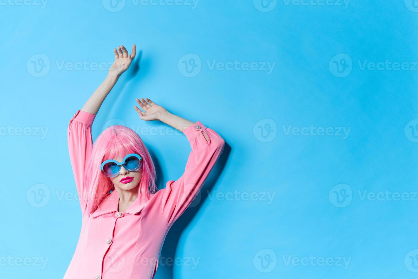 glamorous woman in pink wig pink dress Red lips isolated background photo