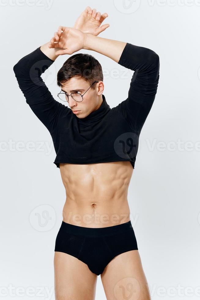 a guy in shorts on a light background and a pumped-up torso sweater photo