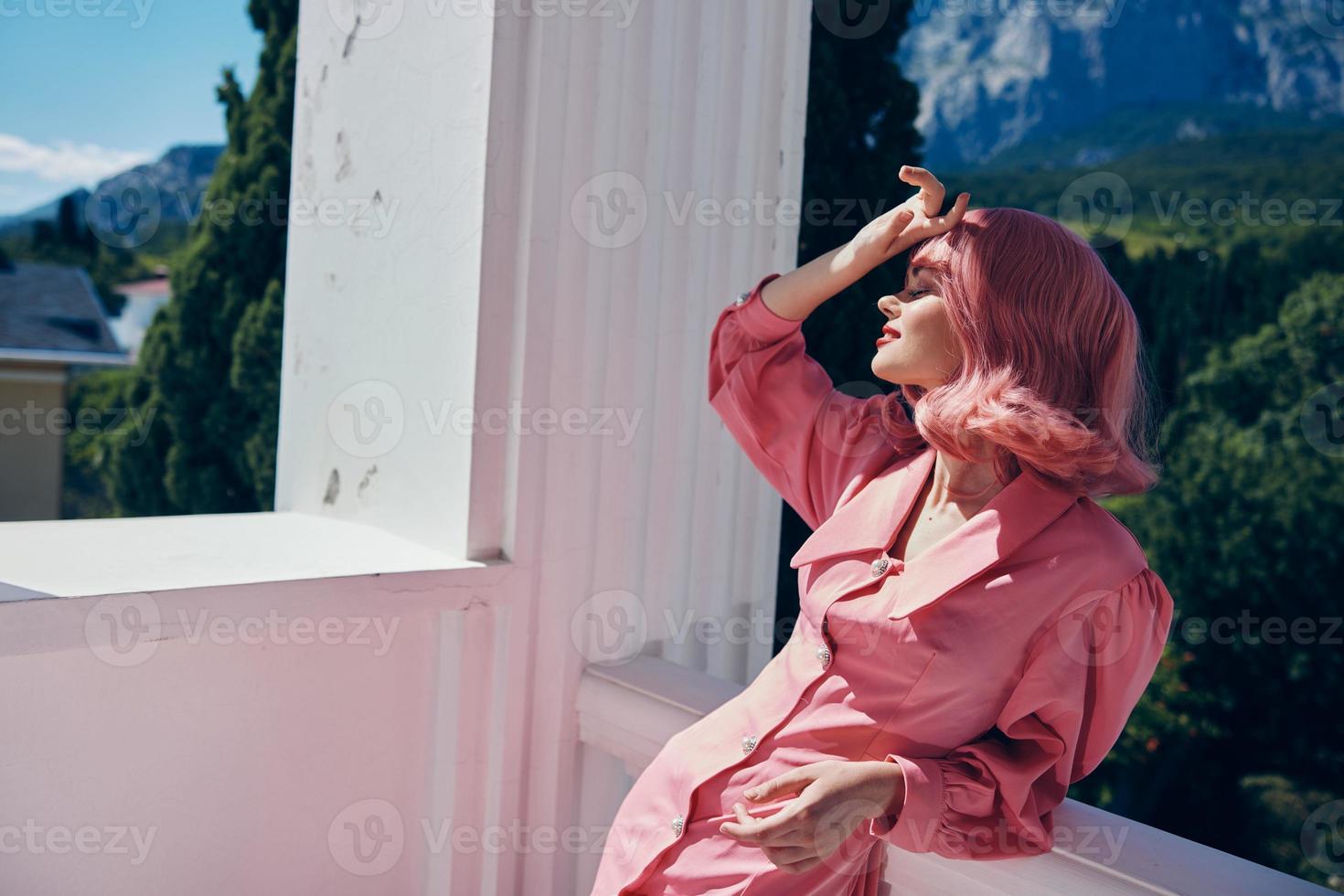 pretty woman posing on the terrace mountain view lifestyle Summer day photo