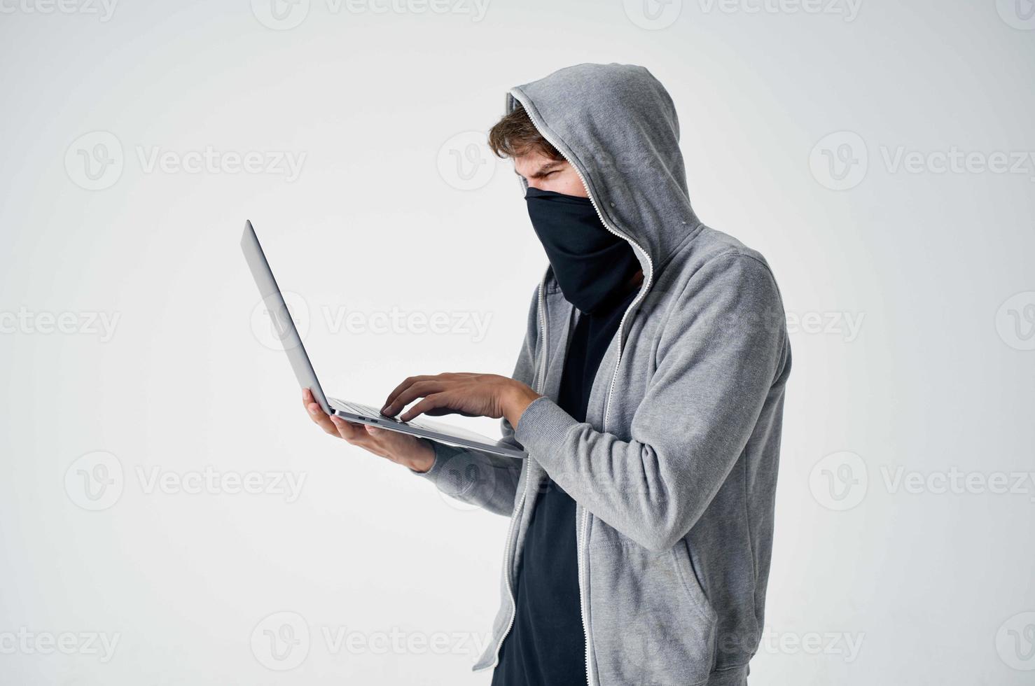 male thief hooded head hacking technology security isolated background photo