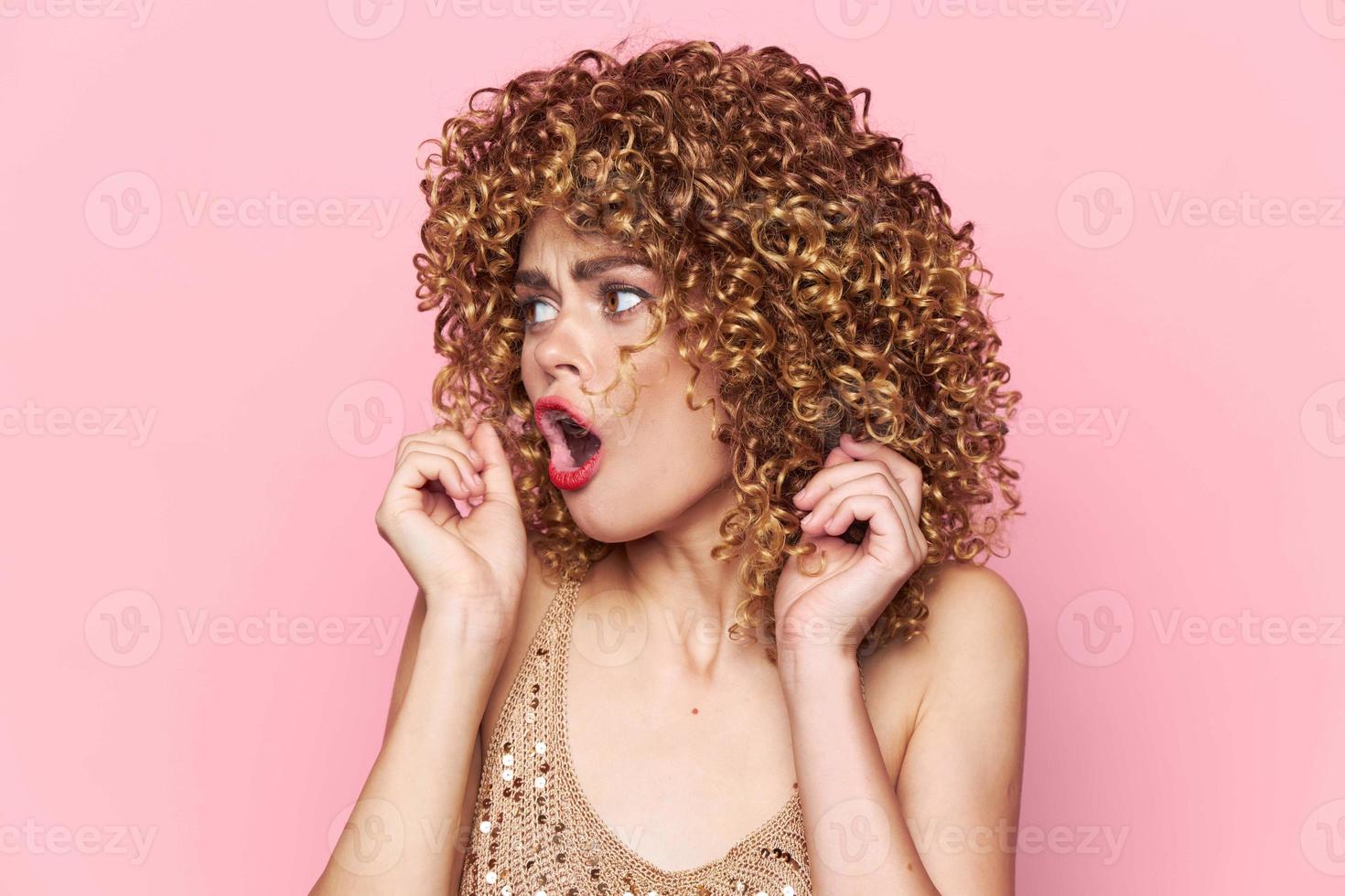 woman curly hair Emotions wide open mouth look towards the model photo