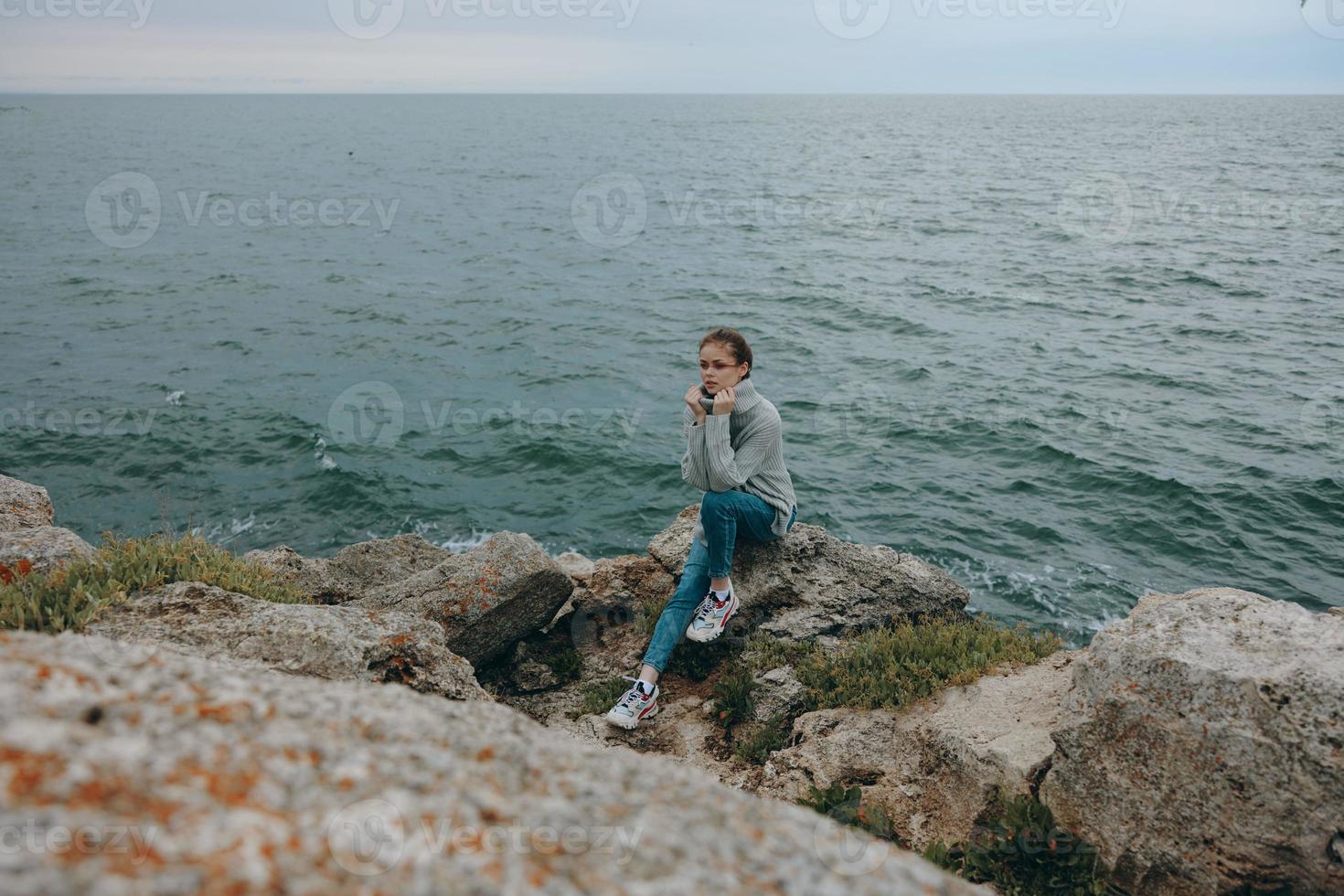 woman sweaters cloudy sea admiring nature female relaxing photo