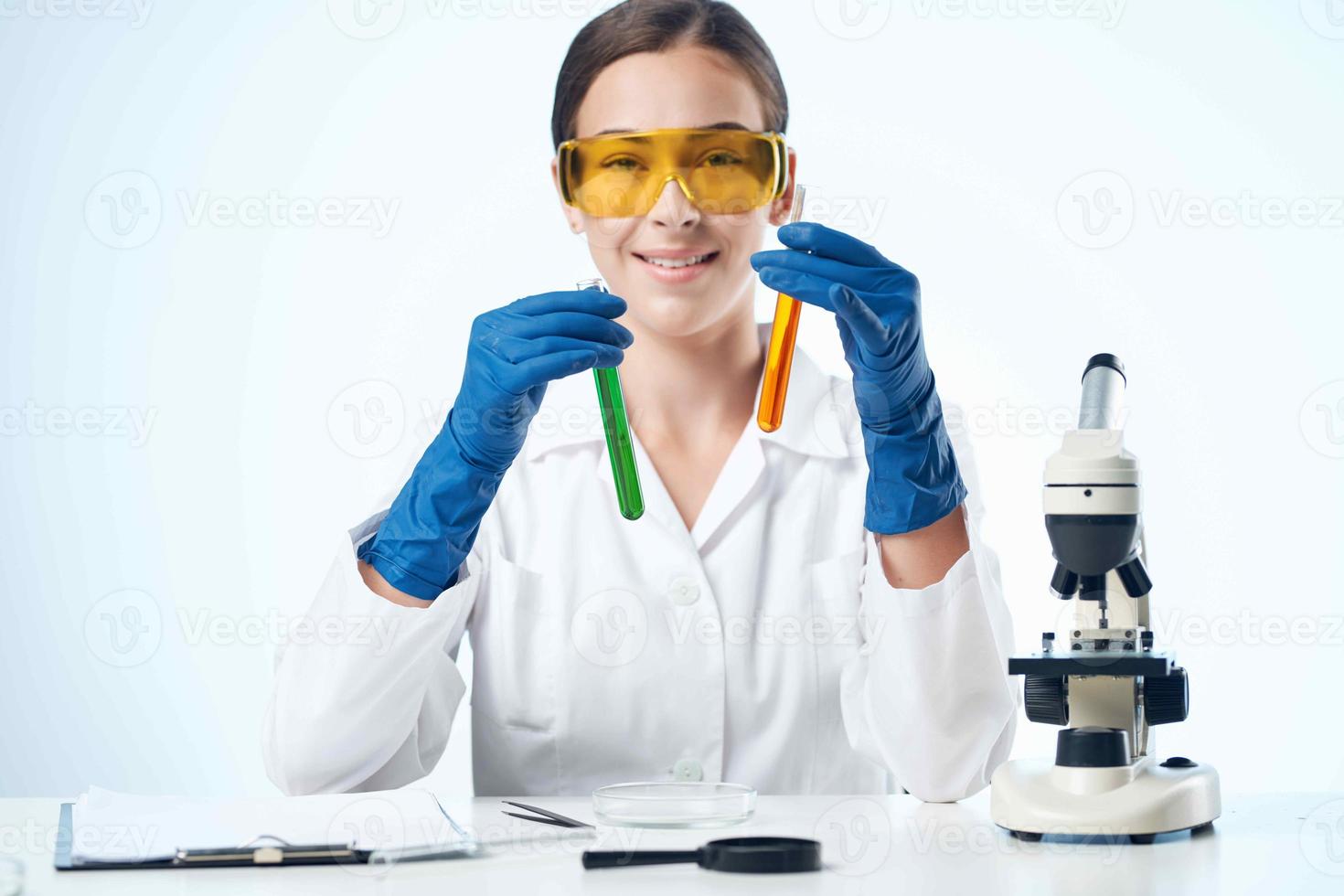 female laboratory assistant desktop chemical solution science Professional photo