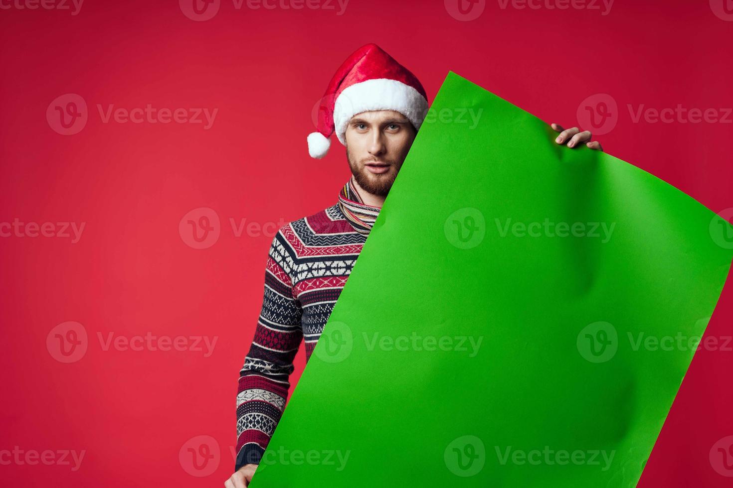 handsome man in New Year's clothes advertising copy space red background photo