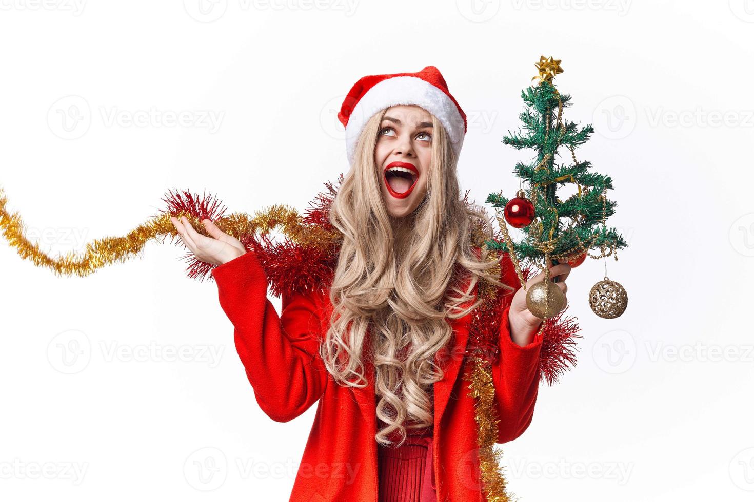 woman dressed as santa claus decorating the tree gifts holiday photo