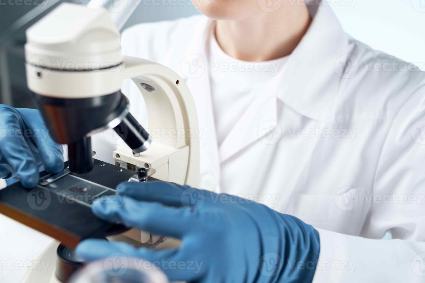 woman laboratory assistant microscope diagnostics research microbiology photo