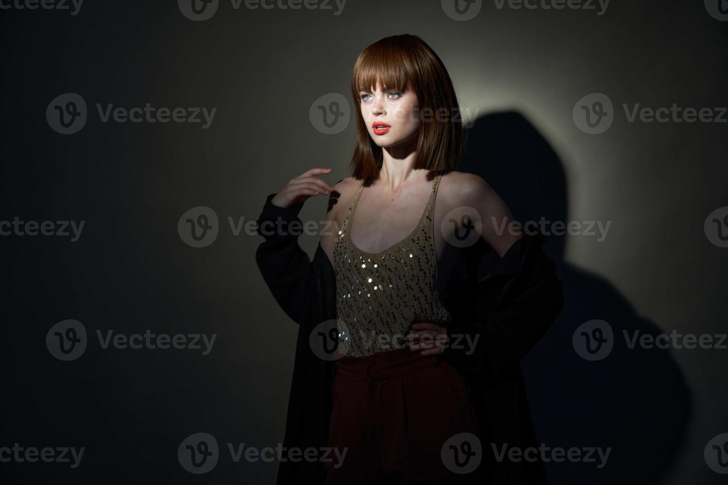 charming woman evening suit dark room cropped view photo