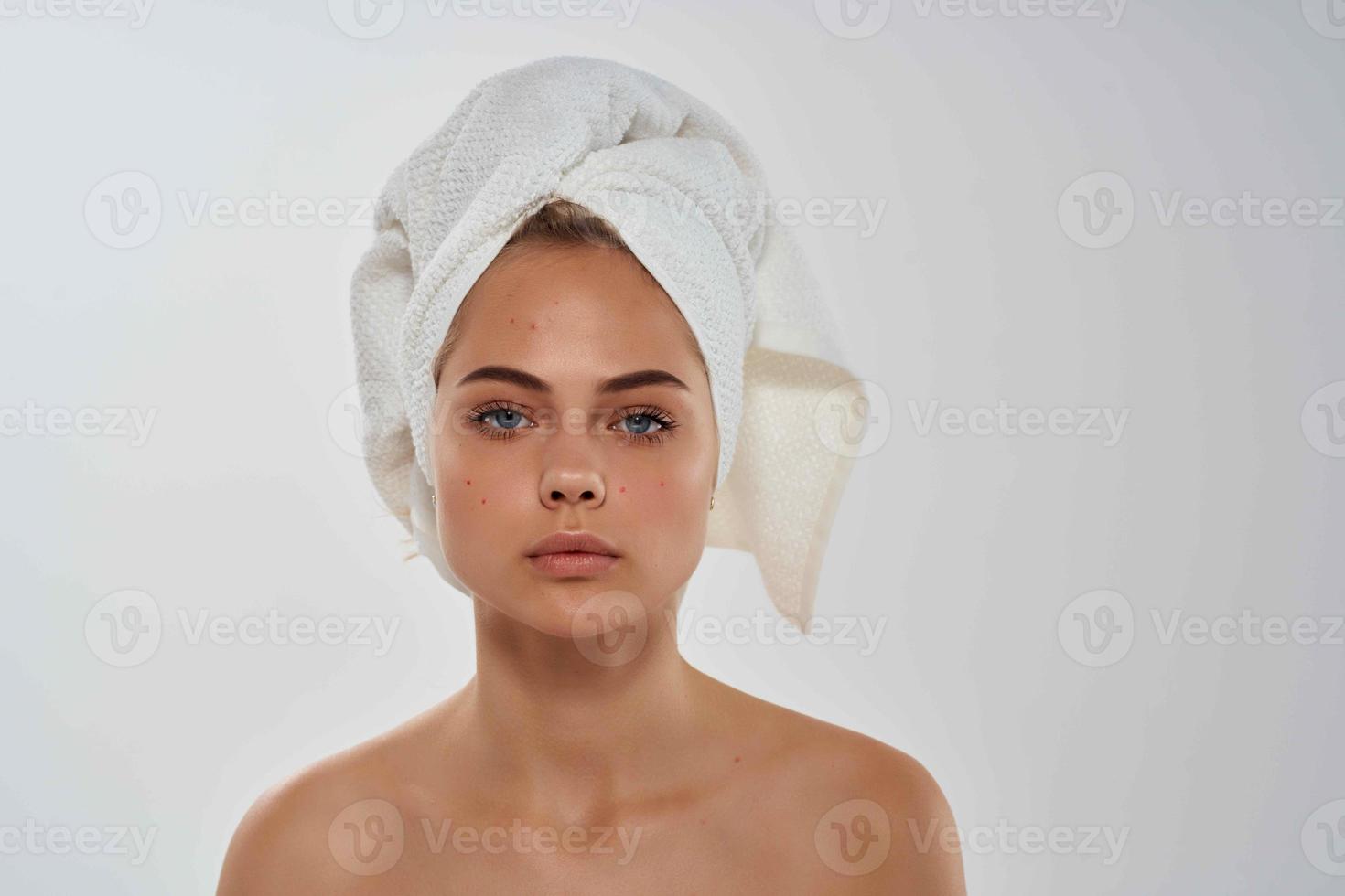 woman with towel on head clean skin makeup hygiene photo