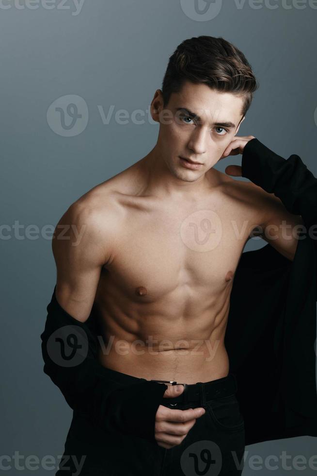 Portrait of sporty appearance male model marine model unbuttoned jacket photo
