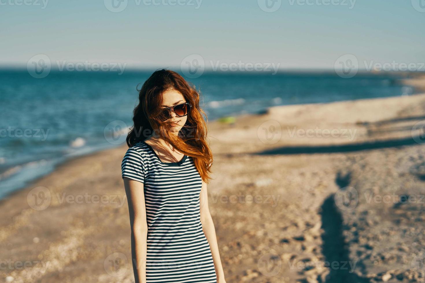 Woman outdoors landscape mountains sun sea photo