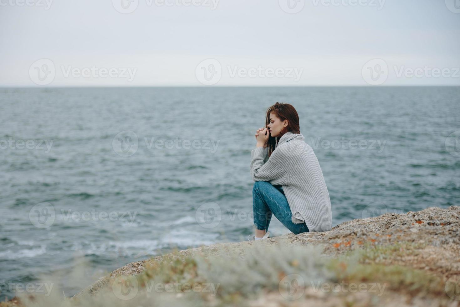 beautiful woman sweaters cloudy sea admiring nature female relaxing photo