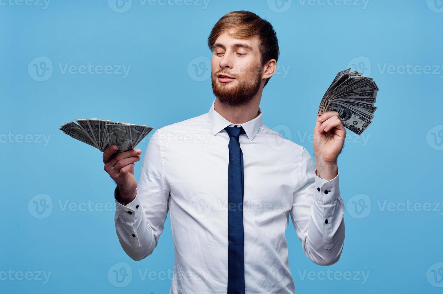 man in shirt with tie finance money self confidence blue background photo