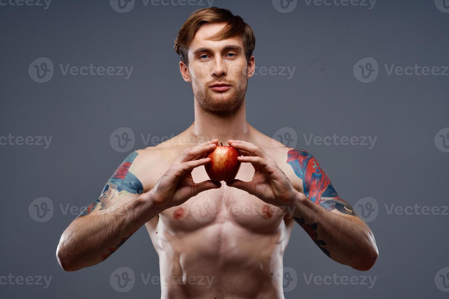 athletic young man with muscular muscles and abs naked torso apple health photo