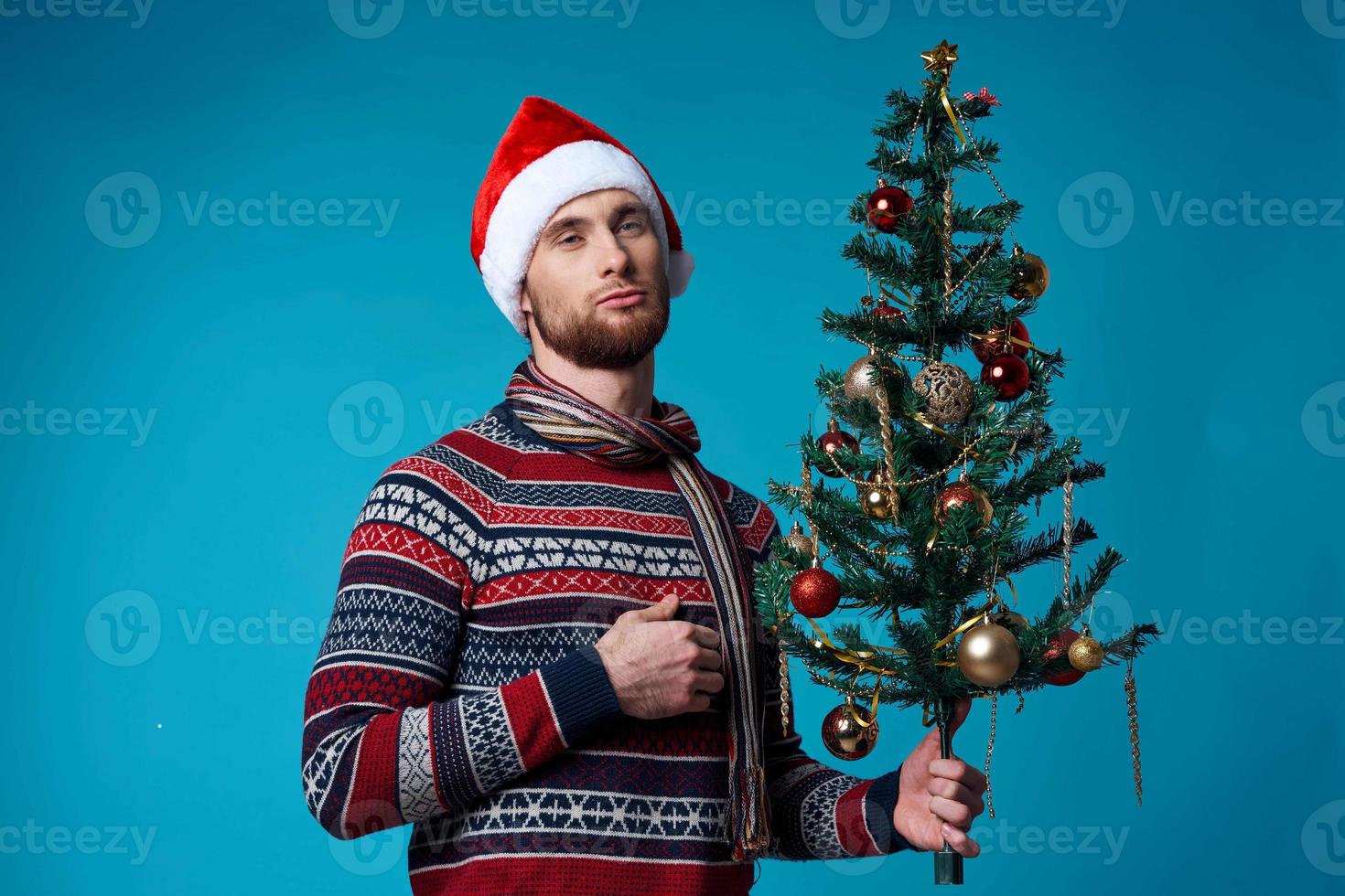 Cheerful man in New Year's clothes advertising copy space isolated background photo