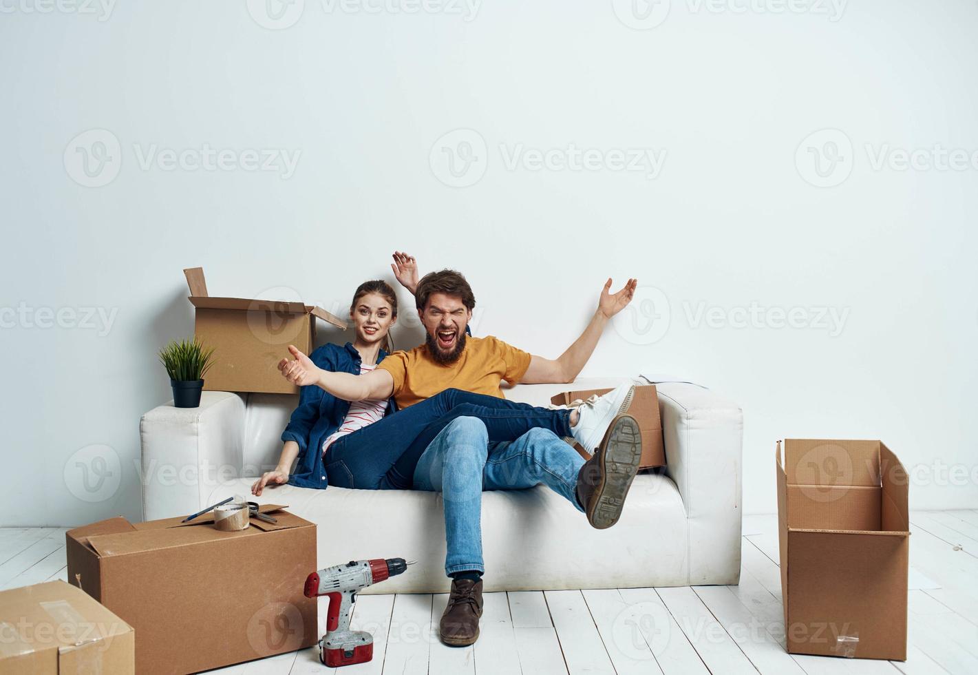 A room on a white sofa with boxes moving apartments photo