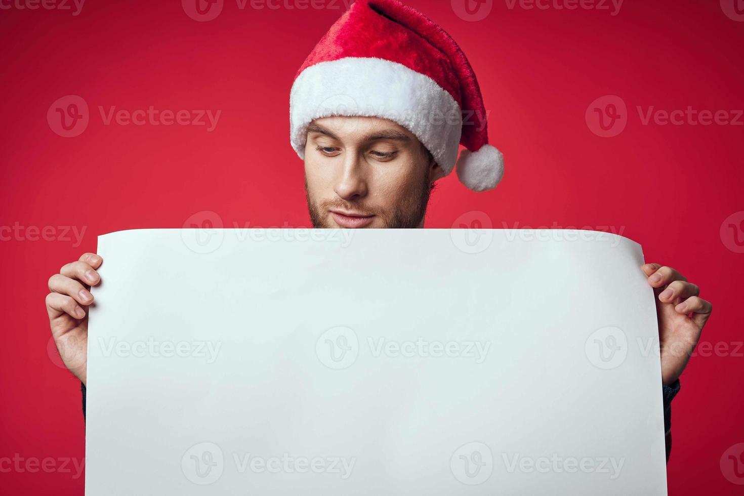 Cheerful man in a christmas white mockup poster studio posing photo