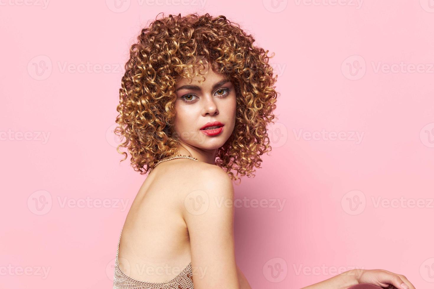 Charming model curly hair pink background pink background photo